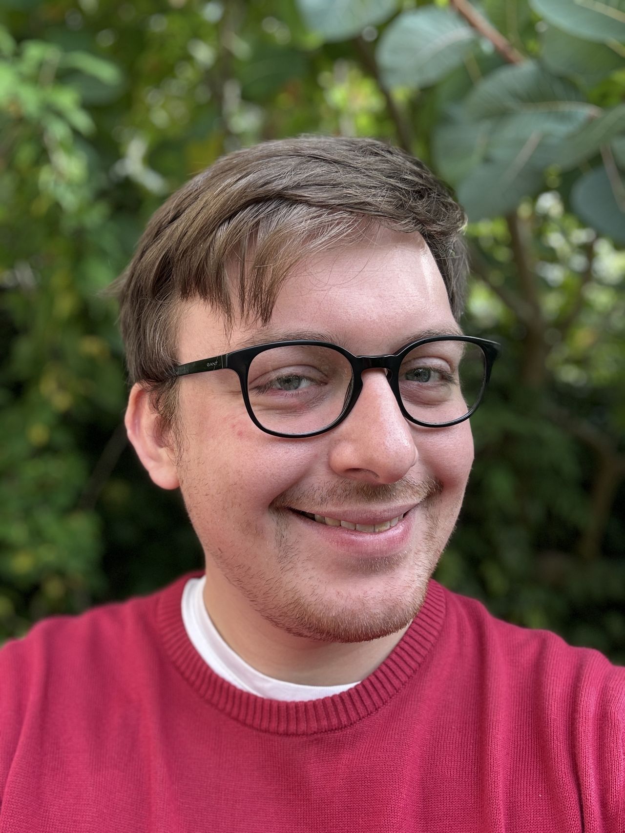 An iPhone 15 Pro Max selfie converted to a portrait mode image