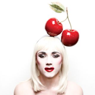 Artificial cherry on her head
