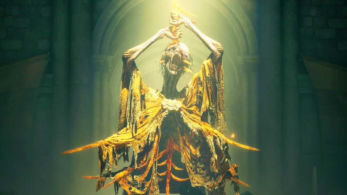 A skeletal man draped in yellow and basked in light pulling an orange blade out of his own head