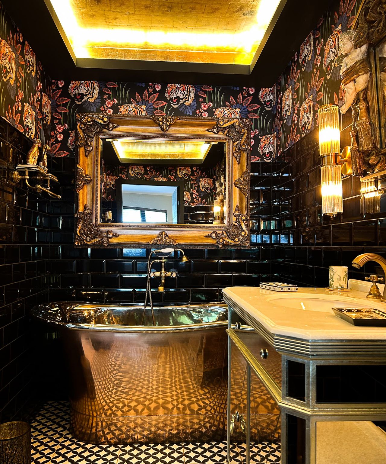 A golden coloured bathroom with a tin bath