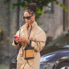 prime day deals editors picks - woman looking down at her phone - getty images 1611727789