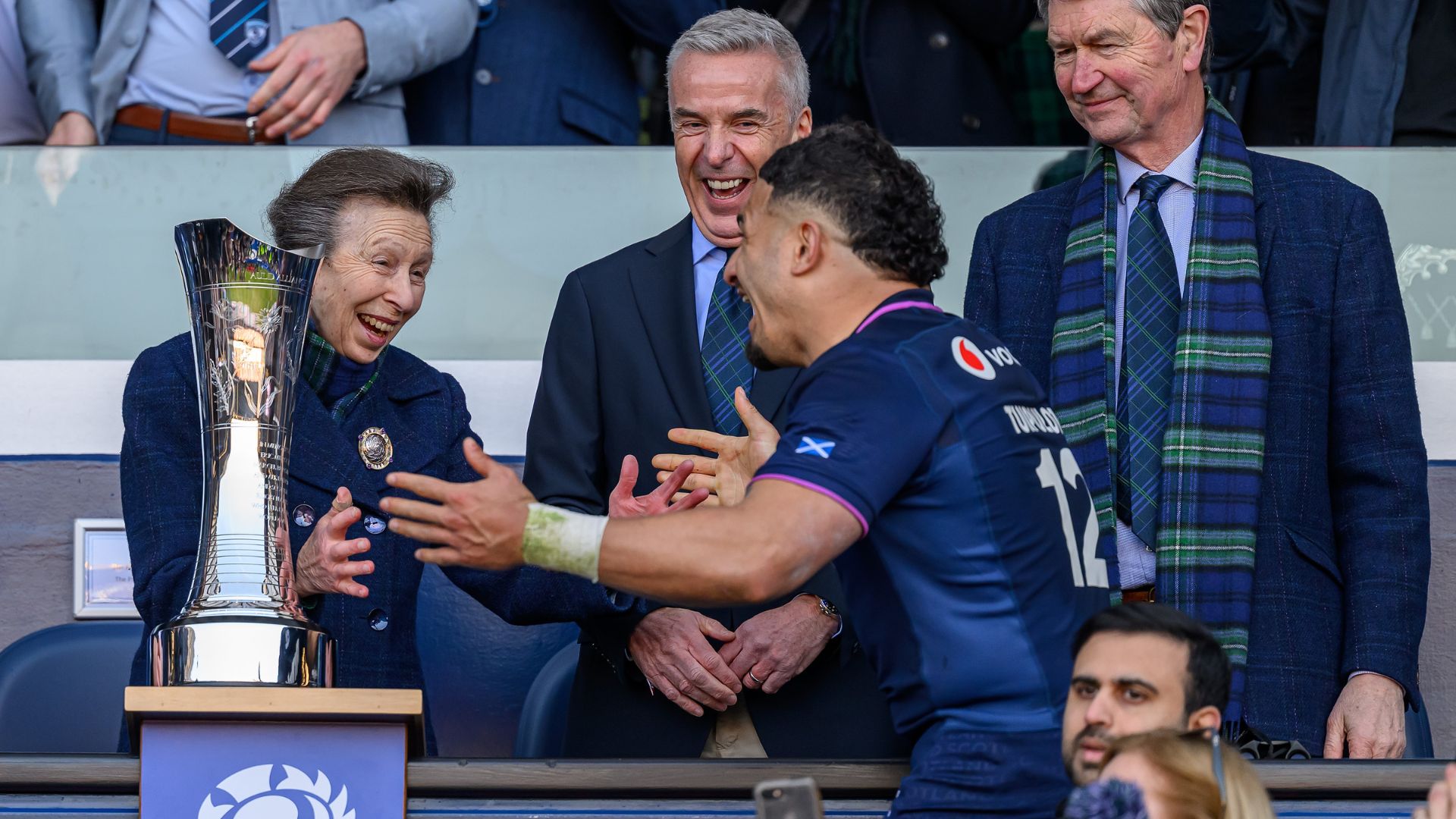 Princess Anne holds her arms out to Sione Tuipulotu of Scotland after the Guinness Six Nations 2026 match between Scotland and France