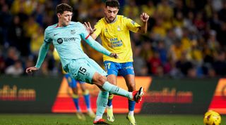 LAS PALMAS, SPAIN - JANUARY 04: Andreas Christensen of FC Barcelona passes the ball under pressure from Munir El Haddadi of UD Las Palmas during the LaLiga EA Sports match between UD Las Palmas and FC Barcelona at Estadio Gran Canaria on January 04, 2024 in Las Palmas, Spain. (Photo by Gabriel Jimenez/Quality Sport Images/Getty Images)