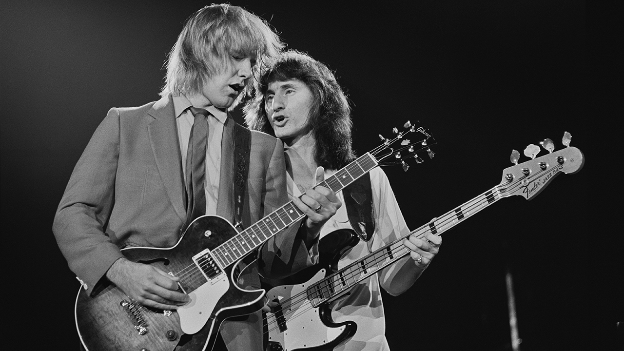 LONDON - NOVEMBER 04:  Photo of RUSH, L-R: Alex Lifeson and Geddy Lee performing live onstage on Exit...Stage Left tour at Wembley Arena in London on November 04 1981. (Photo by Fin Costello/Redferns)