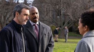 Watch Law & Order season 23 starring Reid Scott (L) as detective Vincent Riley and Mechad Brooks (C) as detective Jalen Shaw pictured speaking to a woman in a park