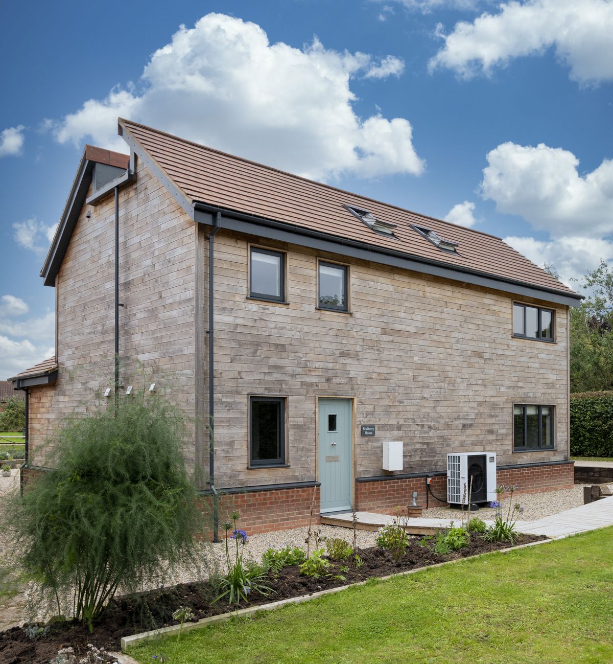oak frame self build with traditional exterior and contemporary open plan interior