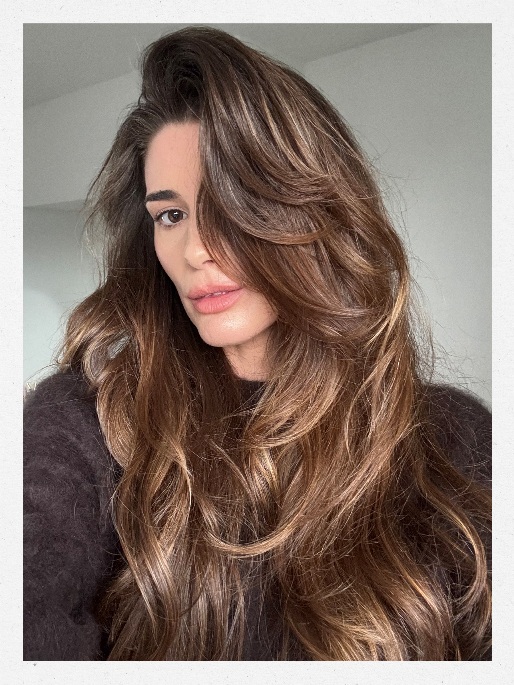 A photo of beauty editor Eleanor Vousden with a bouncy blowdry