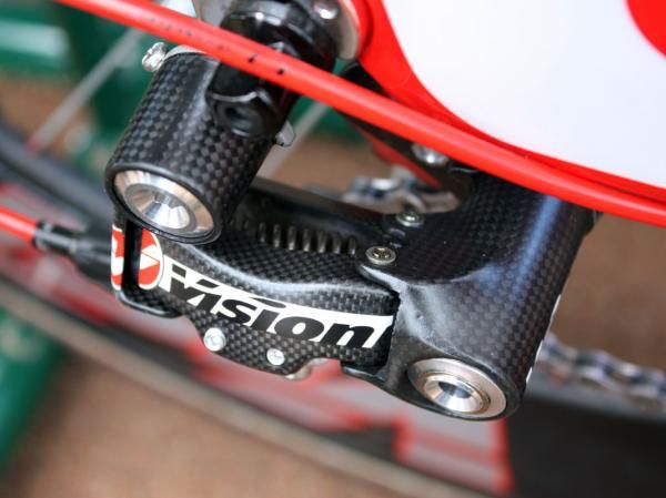 Rear molded carbon fiber is used for all of the major derailleur components - not just carbon-wrapped aluminum.