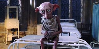 Harry Potter Dobby sits on hospital bed