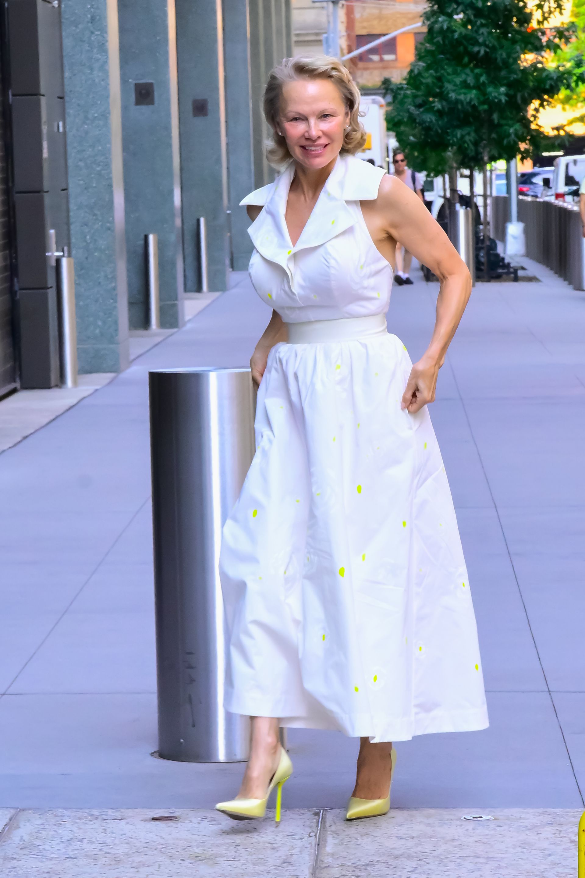 Pamela Anderson wears a white dress