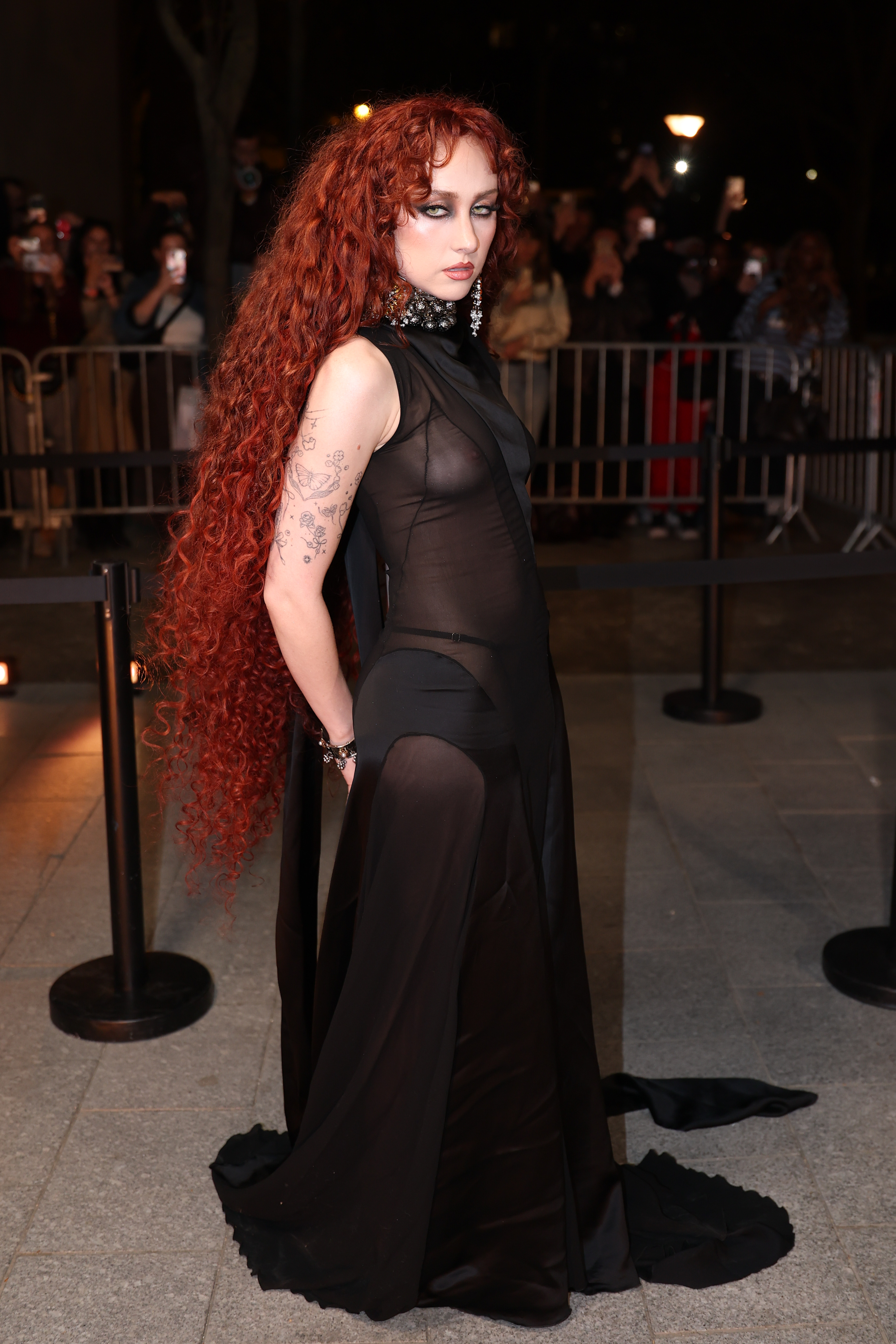 Chappell Roan attended the Alexander McQueen Fall 2026 fashion show in a naked dress and peekaboo thong