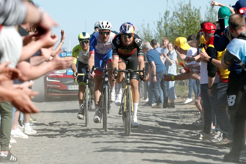 ROUBAIX FRANCE APRIL 17 LR Stefan Kng of Switzerland and Team Groupama FDJ and Wout Van Aert of Belgium and Team Jumbo Visma compete in the chase group passing through a cobblestones sector during the 119th ParisRoubaix 2022 Mens Elite a 2572km one day race from Compigne to Roubaix ParisRoubaix WorldTour on April 17 2022 in Roubaix France Photo by Bas CzerwinskiGetty Images