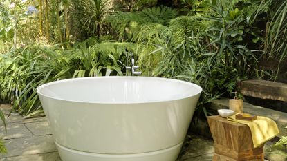 Outdoor bathtub in a garden