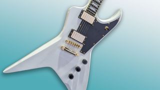 Claudio Sanchez Evil Instruments Jackhammer signature guitar in white finish on a blue background