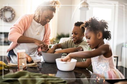 Family mixing cookie dough at home