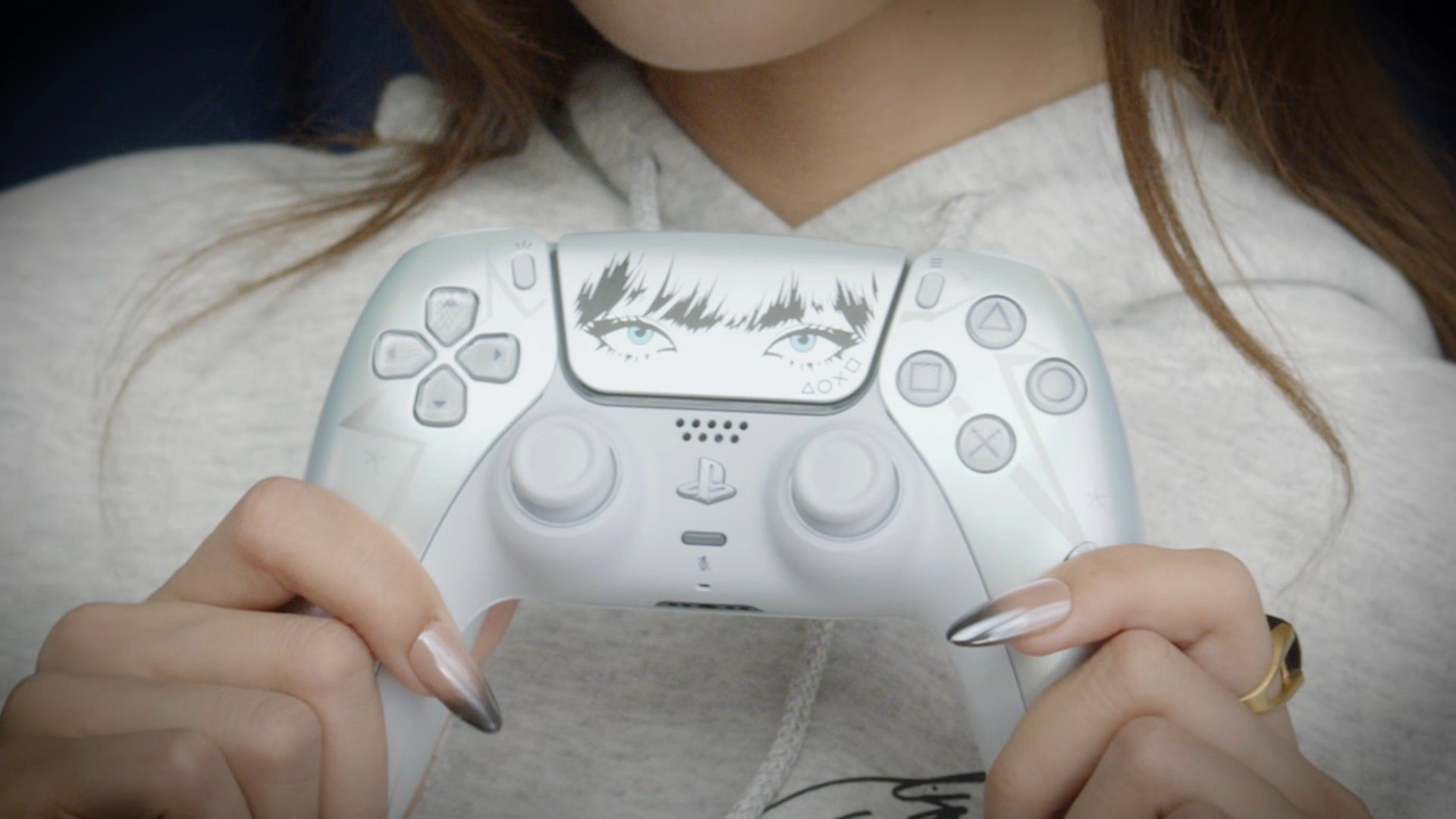 Lisa holding limited edition DualSense controller