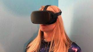 A photo of becca wearing the oculus quest vr headset