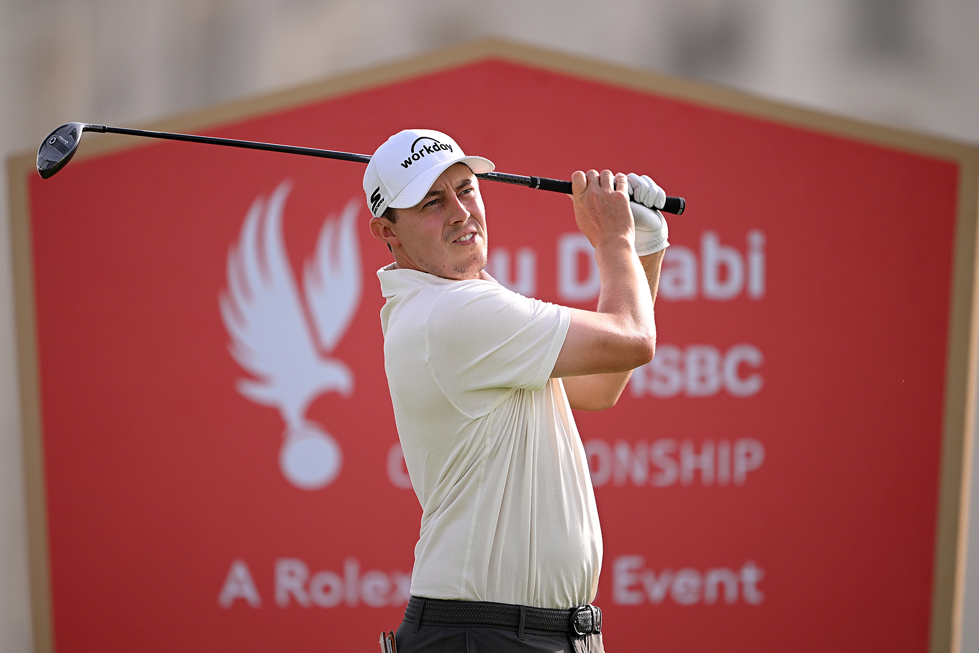 Matt Fitzpatrick in the finish position of the golf swing, watching the ball flight after hitting a tee shot