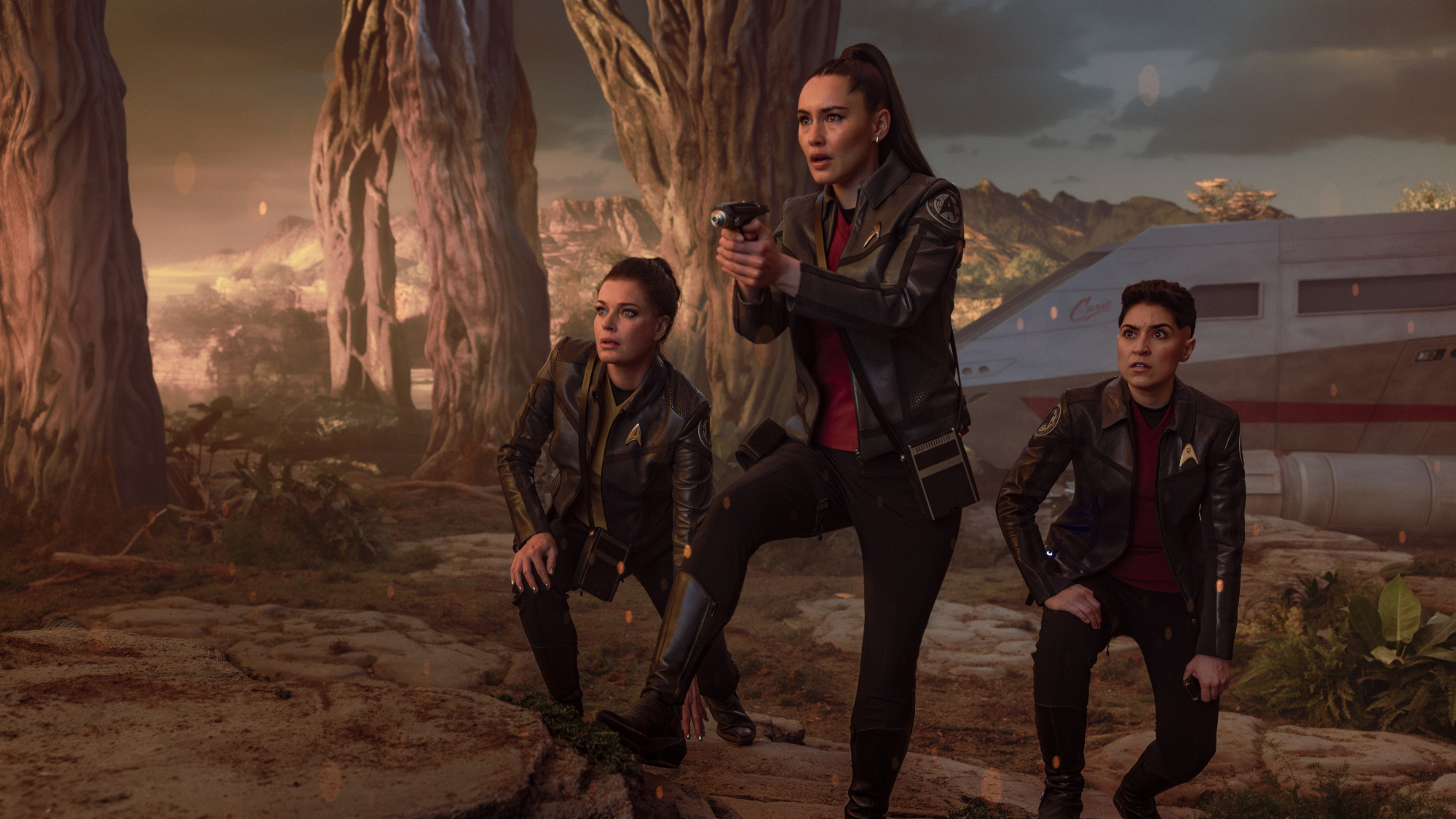 (L-R): Rebecca Romijn as Una, Christina Chong as La&rsquo;an Noonien-Singh, and Melissa Navia as Erica Ortegas in season 4, episode 1, of Star Trek: Strange New Worlds.