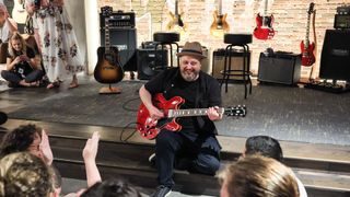 Marty Schwartz giving a guitar lesson