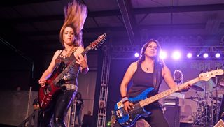 Nikki Stringfield (left) and Wanda Ortiz perform with The Iron Maidens at BMI Indoor Speedway in Versailles, Ohio on June 23, 2018