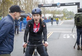 Lauren De Crescenzo reacts to winning the women's division of 2024 The Growler, at the finish line next to event founder Levi Leipheimer