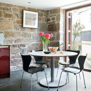 dinning room with pink flower glass vase and dining table chair