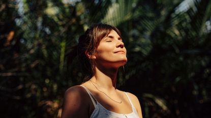 woman smiling and figuring out how to be happy