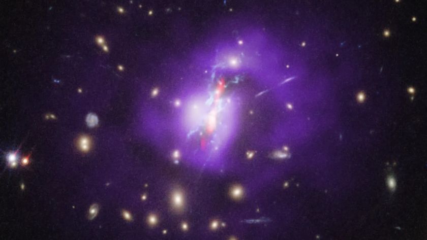 A huge purple blob with a red streak within. There are lots of other glowing blobs all around. Just to the left of the giant purple blob there is a blob in sort of the shape of a spiral.