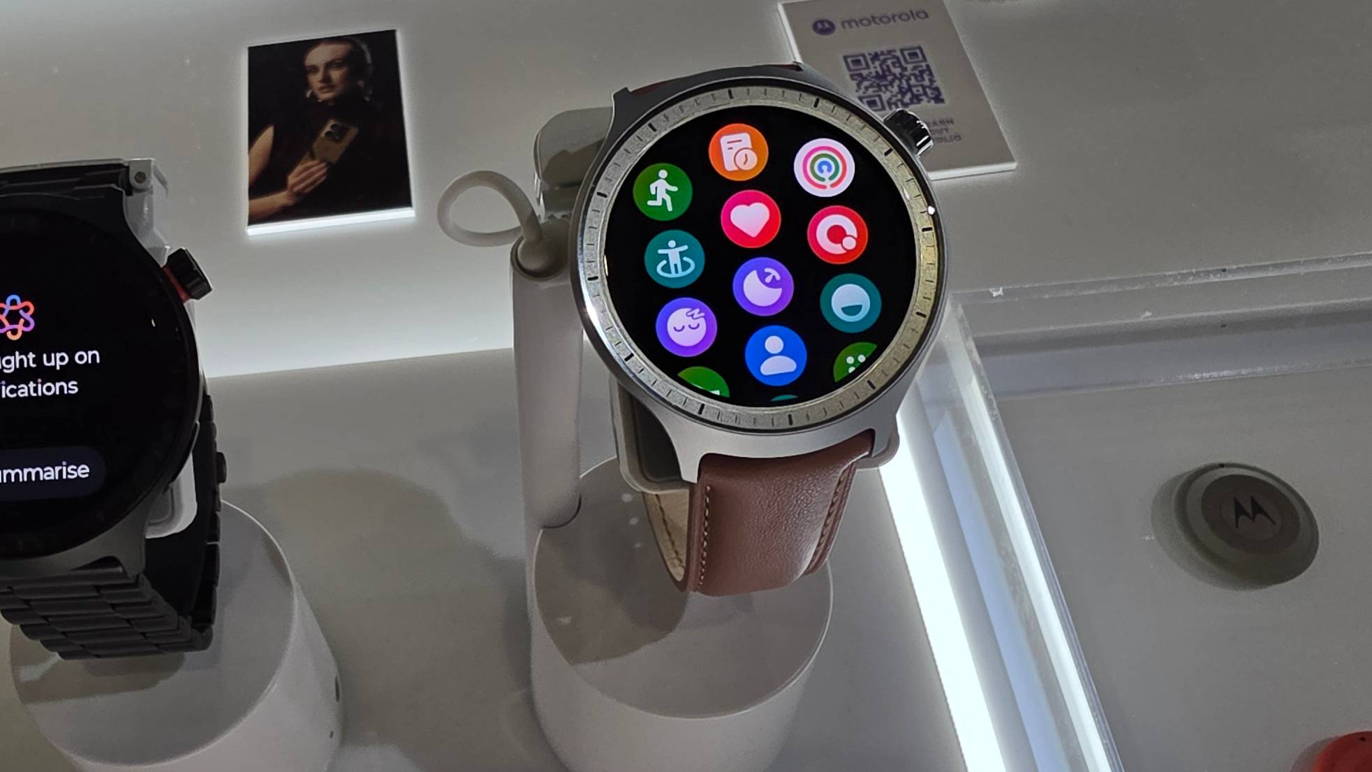 The Moto Watch on a stand.