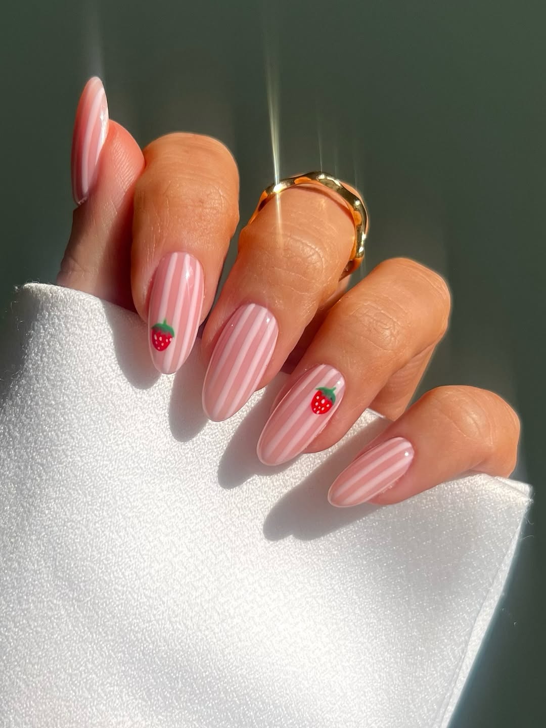 pink and light pink nail stripes with small strawberry decals