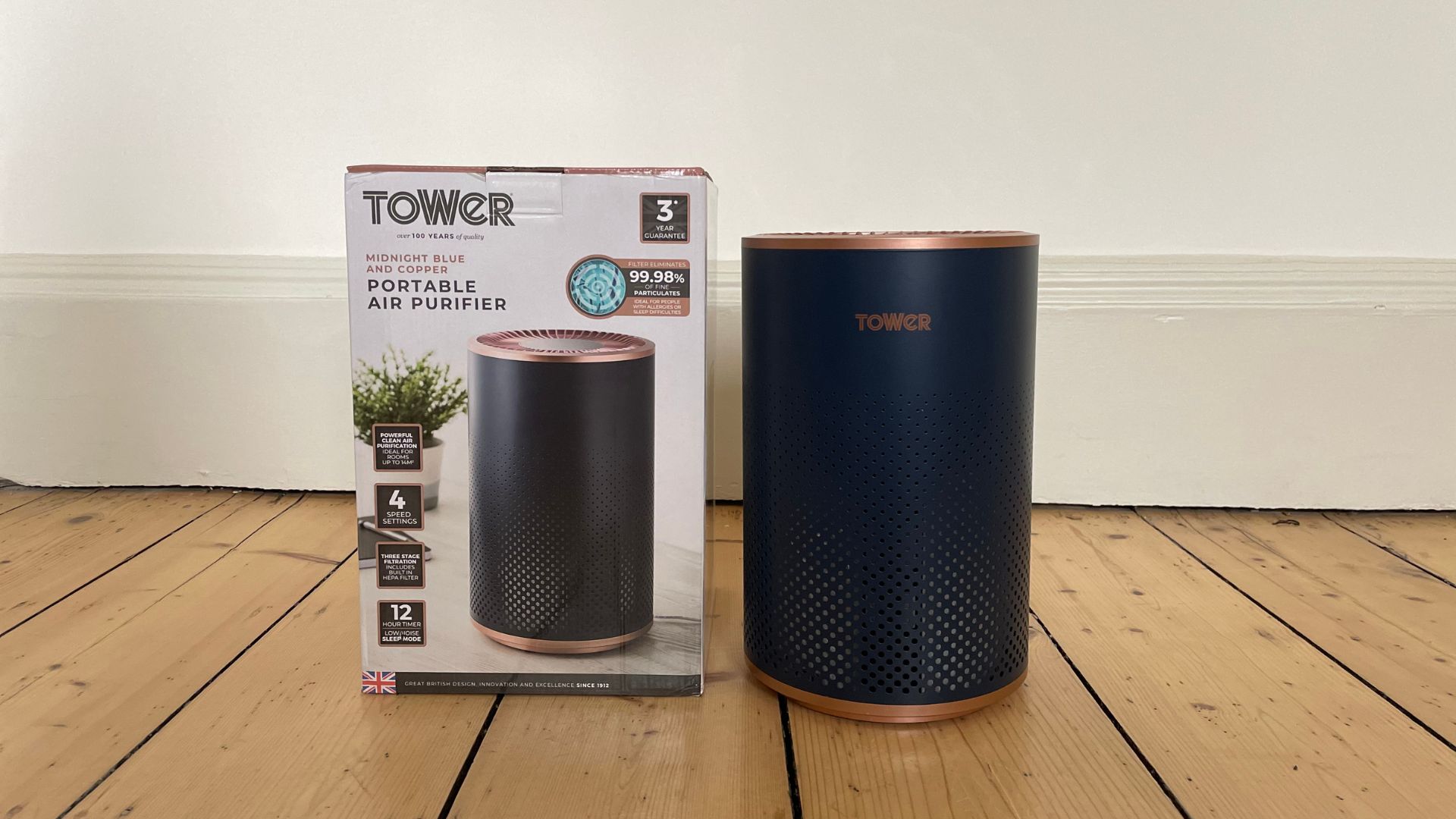 Tower Air Purifier next to its box