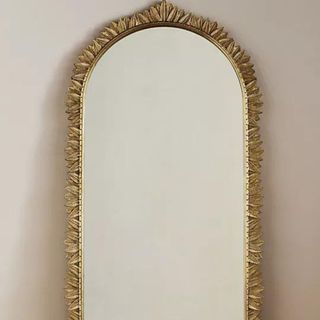 Demeter Mirror against a beige background.