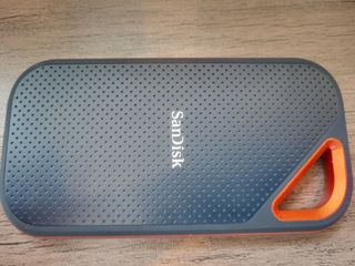 A black and orange SanDisk Extreme PRO Portable SSD