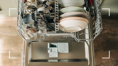 picture of open dishwasher with plates and cutlery