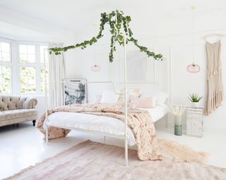 Four poster bed with pink furnishings by The French Bedroom Co