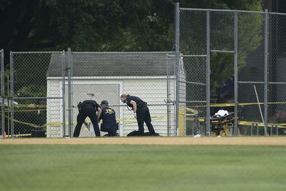 The FBI investigates the scene of the congressional baseball practice shooting.