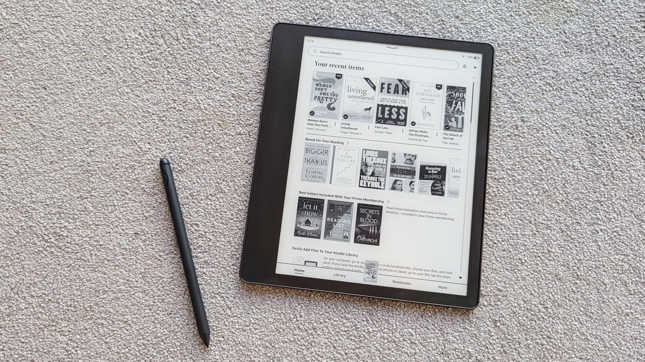 Amazon Kindle Scribe review: ereader and stylus on grey carpet