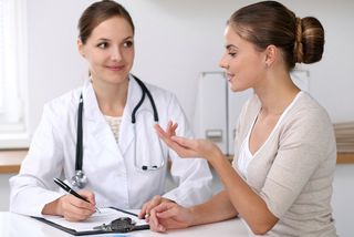 A woman speaking with her doctor.