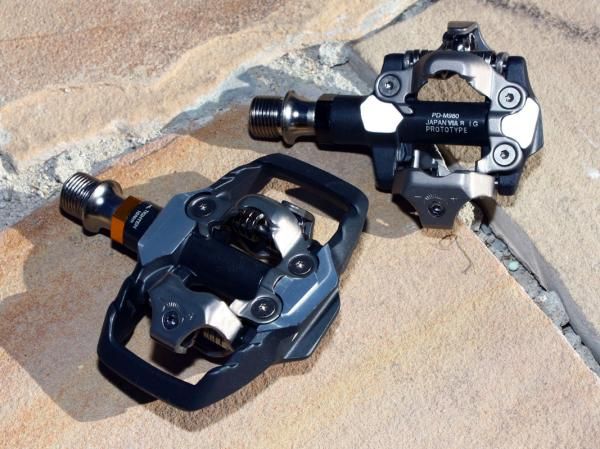 Claimed weight on the PD-M980 pedals (at top) drops to 310g per pair. The Trail-edition PD-M985 are heavier at nearly 400g but feature an even bigger platform plus an additional alloy mini-cage.