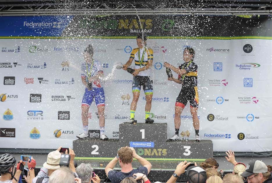 The medalists spray the champagne