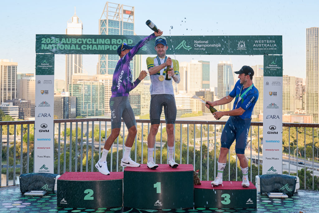 PERTH, AUSTRALIA - JANUARY 12: Lucas Plapp of team Jayco Alula, Luke Durbridge of team Jayco Alula and Liam Walsh of team CCACHE x BODYWRAP celebrate winning the Men's Elite Road Race as part of the 2025 Road Nats on January 12, 2025 in Perth, Australia. (Photo by Stefan Gosatti/Getty Images)