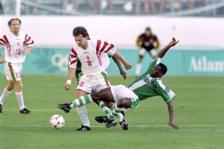 Nigeria's Jay-Jay Okocha (right) fights for the ball with Hungary's Tamas Sandor at the 1996 Olympics in Atlanta.