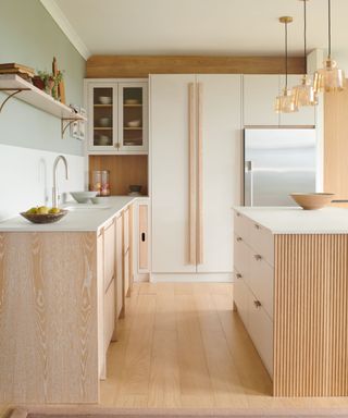 White kitchen with natural wood hardware