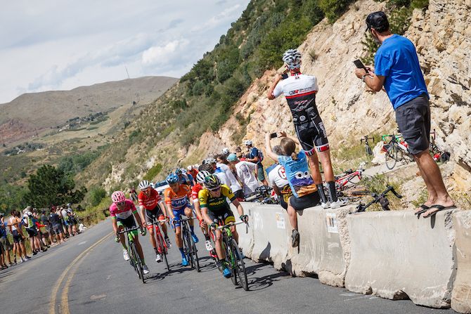 Fans watch as the front group hits another climb on stage 3 of the 2018 Colorado Classic