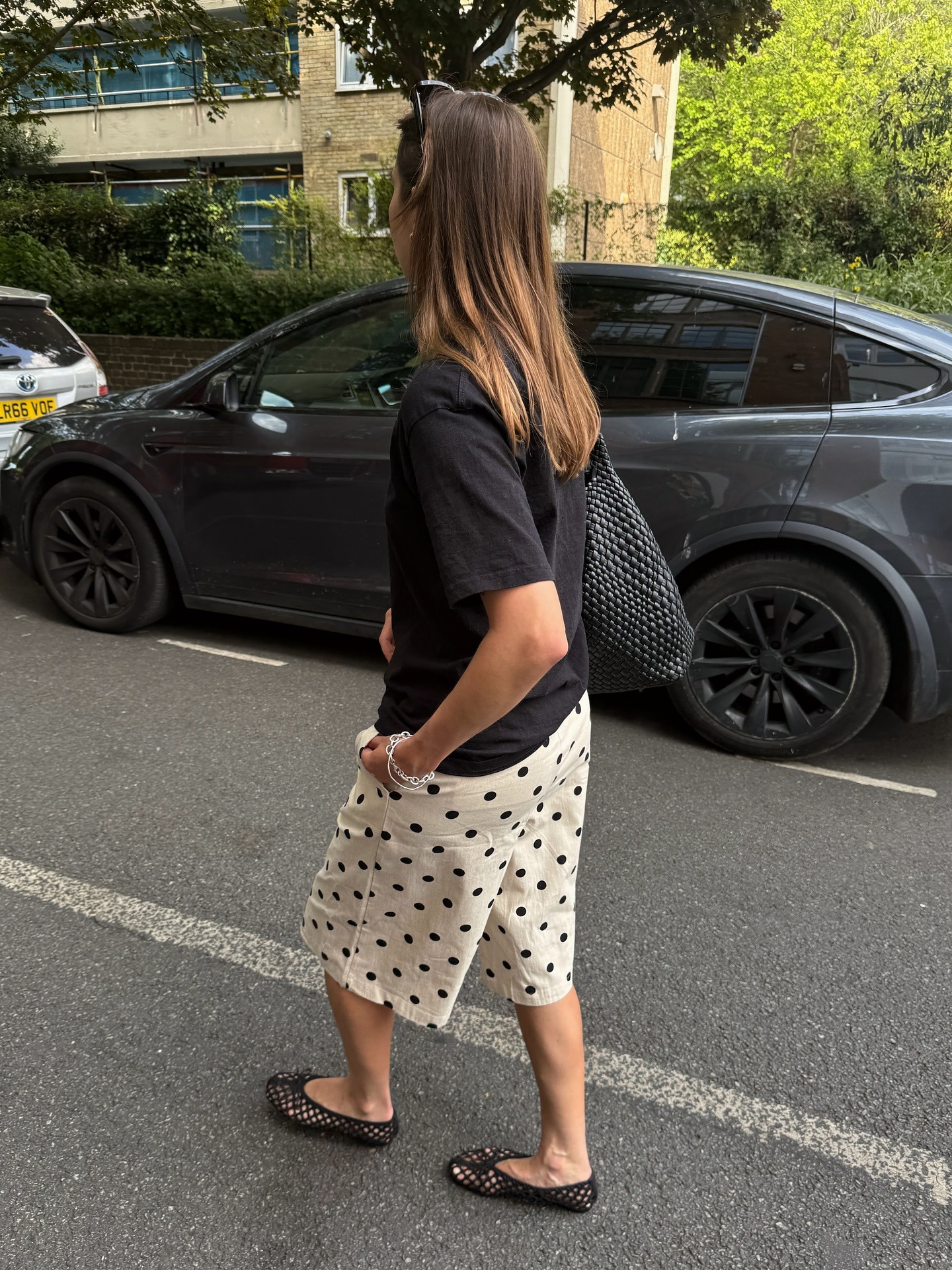 Poppy Almond wears mesh ballet flats.