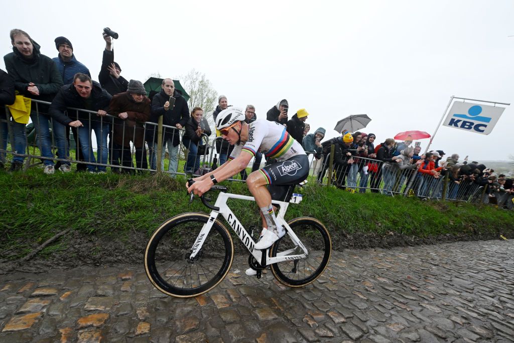 OUDENAARDE BELGIUM MARCH 31 Mathieu van der Poel of The Netherlands and Team Alpecin Deceuninck competes in the breakaway passing through the Kapelleberg cobblestones sector during the 108th Ronde van Vlaanderen Tour des Flandres 2024 Mens Elite a 2708km one day race from Antwerpen to Oudenaarde UCIWT on March 31 2024 in Oudenaarde Belgium Photo by Dario BelingheriGetty Images
