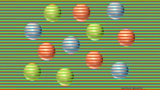 12 colored spheres (4 red, 4 purple, 4 green) with a striped green background. Although they look like different colors, all the spheres are actually beige
