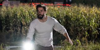 John Krasinski fleeing from the creatures in A Quiet Place