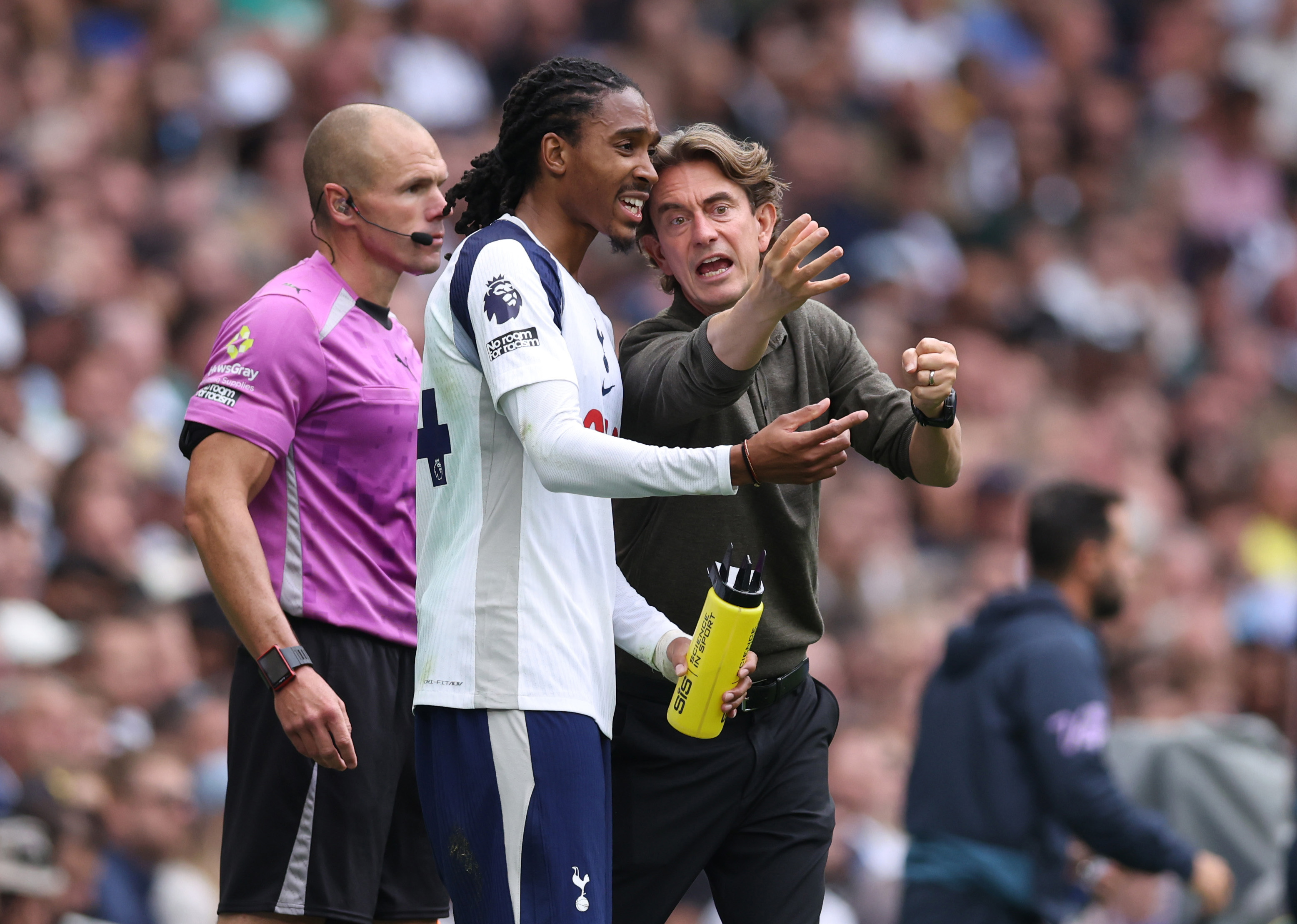 LONDON, ENGLAND - AUGUST 30: Thomas Frank manager / head coach of Tottenham Hotspur speaks with Djed Spence of Tottenham Hotspur during the Premier League match between Tottenham Hotspur and Bournemouth at Tottenham Hotspur Stadium on August 30, 2025 in London, England. (Photo by Catherine Ivill - AMA/Getty Images)